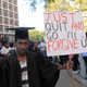 A jobless University graduate demonstrates outside of parliament in Harare.